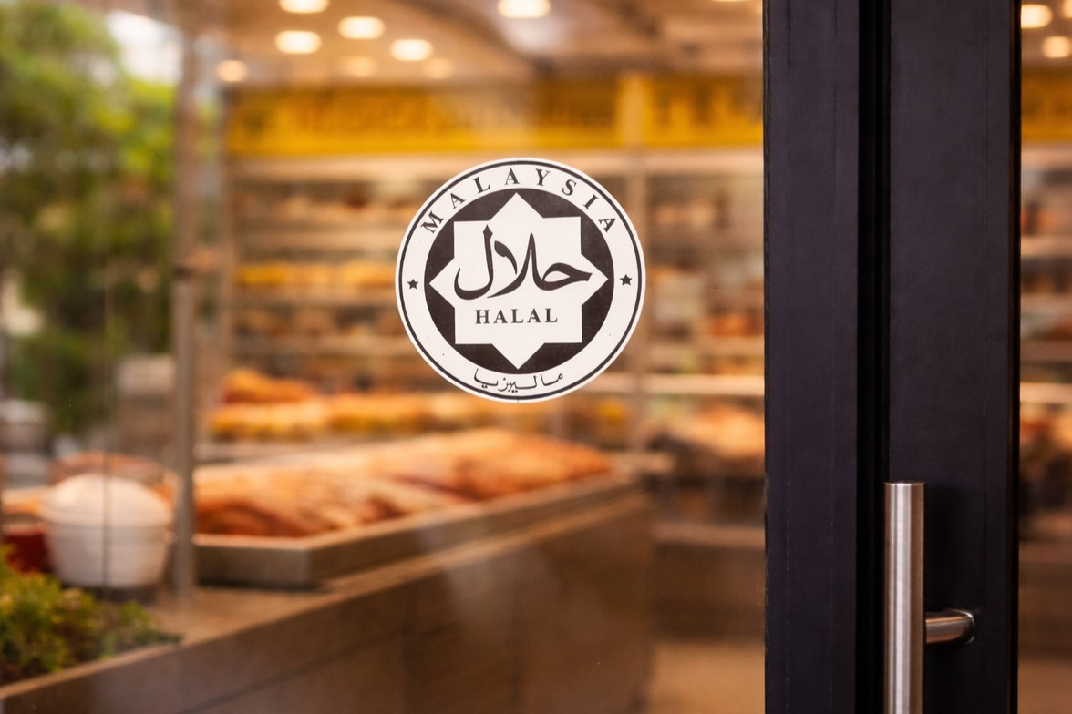Halal logo by JAKIM Malaysia on window of food outlet or restaurant